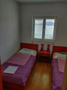 Posteľ alebo postele v izbe v ubytovaní Apartments Jerkovic