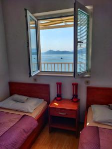Posteľ alebo postele v izbe v ubytovaní Apartments Jerkovic