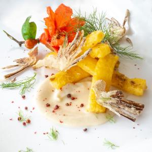 a white plate with a dish of food with fruit at Altarocca Wine Resort Adults Only in Orvieto +229 photos