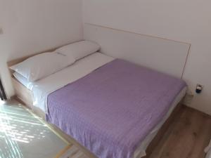 Postel nebo postele na pokoji v ubytování Apartmani Šime - 1