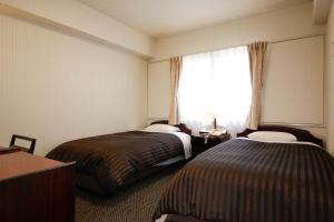 Postel nebo postele na pokoji v ubytování Hotel Sunlife
