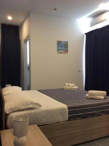 Krevet ili kreveti u jedinici u okviru objekta Naxos Laguna Beach