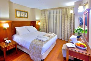 Cama ou camas em um quarto em Hotel Perula & SPA