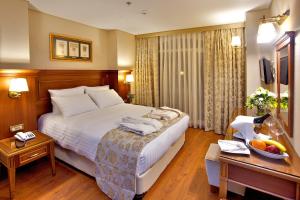 Cama ou camas em um quarto em Hotel Perula & SPA