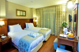 Cama ou camas em um quarto em Hotel Perula & SPA