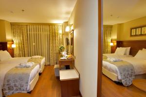 Cama ou camas em um quarto em Hotel Perula & SPA mais 37 fotos