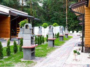 a row of tombstones in a cemetery at Radawa - Domki przy Stadninie in Radawa