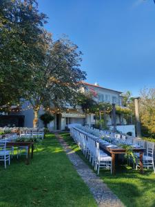a row of tables and chairs in front of a building at Quinta da Paciencia in Sintra