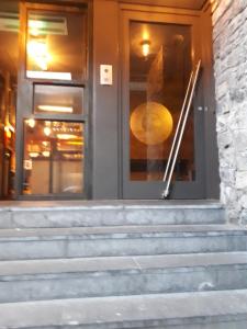 a set of stairs in front of a door at Luxurious Penthouse Apartment 1 , City Centre in Kilkenny