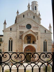 a church with a clock tower on top of it at Residenza Duomo3 - Apartments in Verona