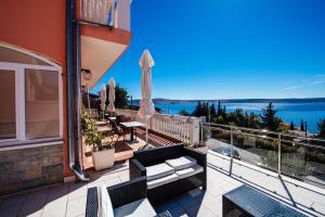 a balcony with a view of the water at Apartments Amari in Starigrad