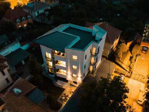 an overhead view of a building with a blue roof at Charm Boutique Hotel in Satu Mare