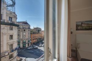 a view of a city street from a window at Tritone Top House in Rome