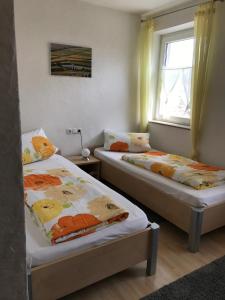 เตียงในห้องที่ Ferien- und Winzerhof Ute Braun