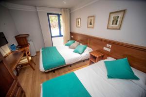 Postel nebo postele na pokoji v ubytování Hotel Alba + 37 fotografií