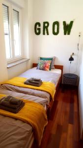 Posteľ alebo postele v izbe v ubytovaní Apartment Greenhouse