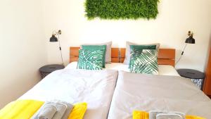 Posteľ alebo postele v izbe v ubytovaní Apartment Greenhouse