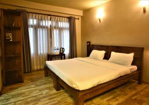 
A bed or beds in a room at Sabila Boutique Hotel
