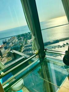 a view of the ocean from the glass floor of a building at SEA TOWERS PENTHOUSE 23-24 Two-Floors Sea View Panoramic Terrace 110m2 !!! jacuzzi in Gdynia