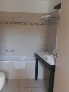 Koupelna v ubytování hôtel Le Synaya