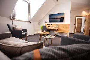 TV a/nebo společenská místnost v ubytování Hotel Tannenhaus
