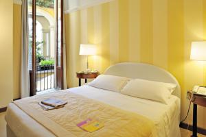 Postel nebo postele na pokoji v ubytování Hotel Gran Duca Di York