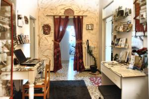 a home office with a desk and a door at B&B Le Terrazze Fermo in Fermo