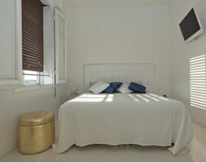 Un pat sau paturi într-o cameră la Domus Dotta