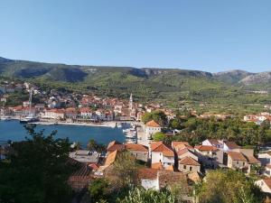 a town with a harbor and boats in the water at Apartments Nela in Jelsa