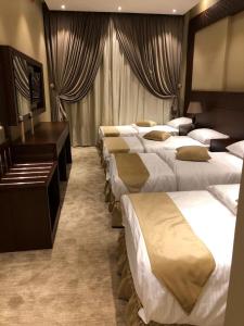 Tempat tidur dalam kamar di Al Hayaah Bayta