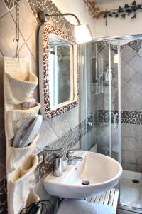 a bathroom with a sink and a shower and a mirror at B&B Le Terrazze Fermo in Fermo +134 photos