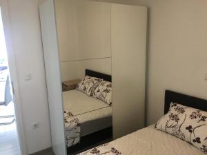Posteľ alebo postele v izbe v ubytovaní Apartmani Eden Vrsi Mulo