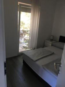 Posteľ alebo postele v izbe v ubytovaní Apartmani Eden Vrsi Mulo