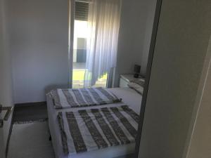 Posteľ alebo postele v izbe v ubytovaní Apartmani Eden Vrsi Mulo