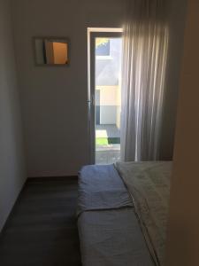 Posteľ alebo postele v izbe v ubytovaní Apartmani Eden Vrsi Mulo