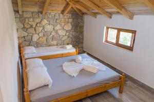 Ένα ή περισσότερα κρεβάτια σε δωμάτιο στο Leonida Resort