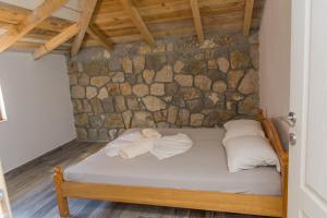 Ένα ή περισσότερα κρεβάτια σε δωμάτιο στο Leonida Resort