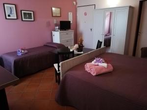Postel nebo postele na pokoji v ubytování B&B LA Garzetta