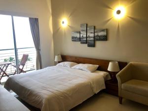 
a hotel room with two beds and two lamps at Prime Wave Residence in Mount Lavinia
