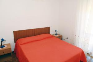 Dimore Dell'Isola Rossa tesisinde bir odada yatak veya yataklar