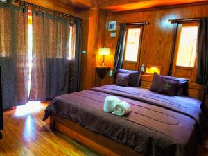 Postel nebo postele na pokoji v ubytování Baansuan Resort