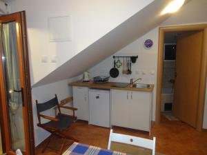 Kuchyň nebo kuchyňský kout v ubytování Apartment Gliha
