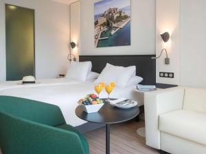 Postel nebo postele na pokoji v ubytování Mercure Ajaccio
