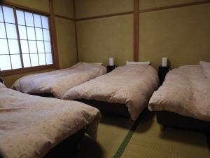 Hunter Lodge tesisinde bir odada yatak veya yataklar