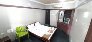 Posteľ alebo postele v izbe v ubytovaní Hotel Prakash