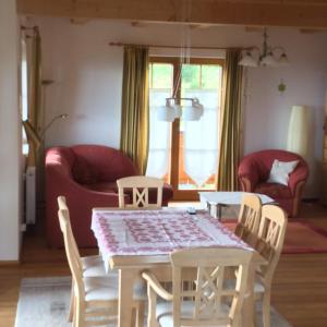 a dining room with a table and chairs at Almhaus Karantanien in Hochrindl