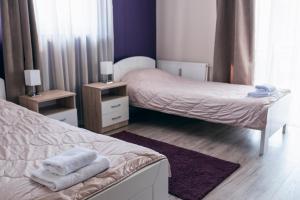 Postel nebo postele na pokoji v ubytování Hotel Euforia Lounge