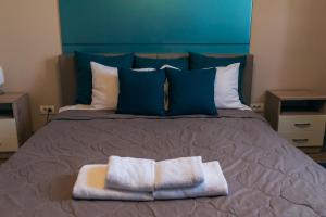 Postel nebo postele na pokoji v ubytování Hotel Euforia Lounge