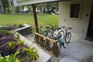 two bikes are parked outside of a house at Aoredise in Luganville