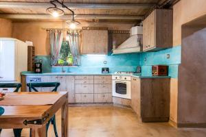 A kitchen or kitchenette at Vrisali Traditional Stone Villa
